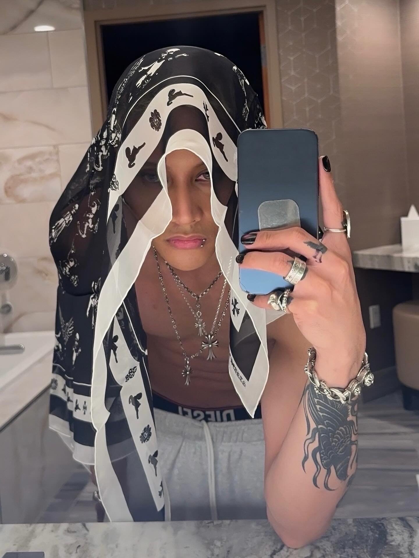 FELIP wearing scarf from Chrome Hearts posted by @felipsuperior via instagram