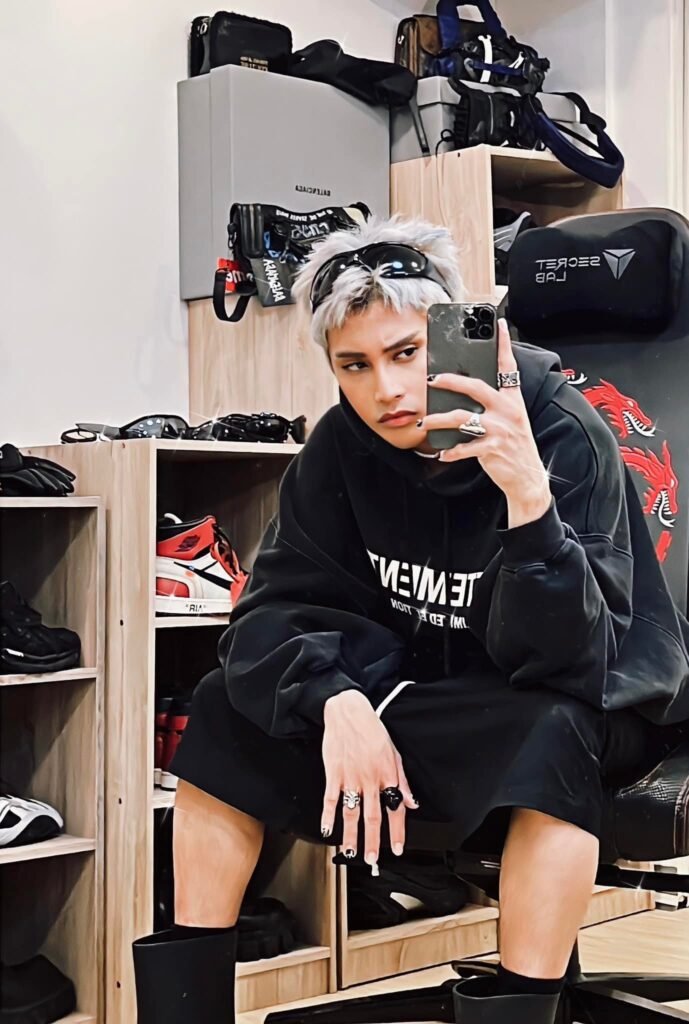 FELIP takes a mirror selfie wearing a VETEMENTS logo print hoodie with his Gojo inspired hair